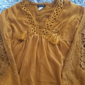 Beautiful gold flowy top -accents on the chest and sleeves. Size 6